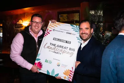 Composite Prime team holding welcome sign for the Great Big landscaping Party